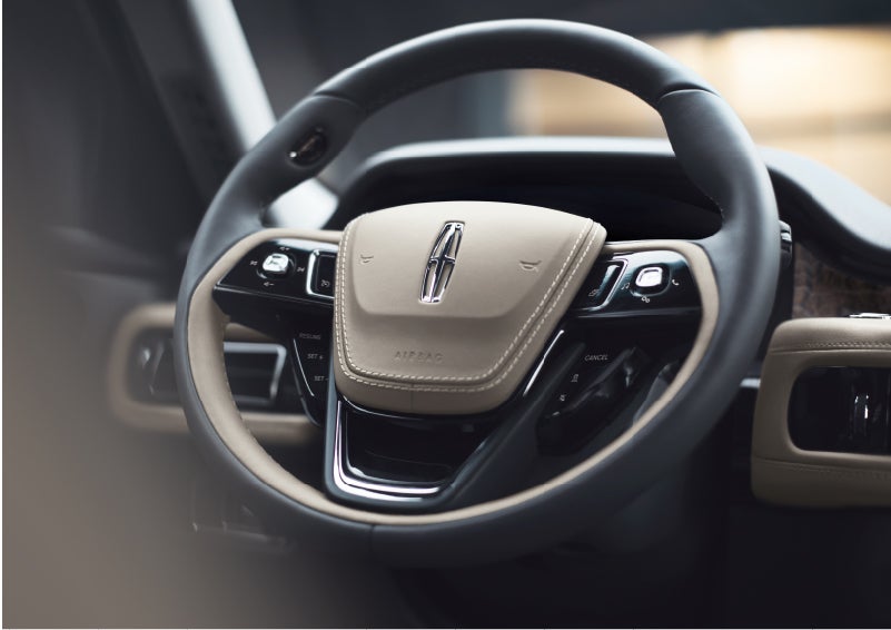 The intuitively placed controls of the steering wheel on a 2023 Lincoln Aviator® SUV | Thomasville Lincoln in Thomasville GA
