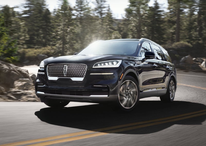 A Lincoln Aviator® SUV is being driven on a winding mountain road | Thomasville Lincoln in Thomasville GA