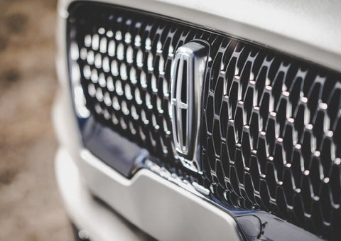 The grille of the 2024 Lincoln Aviator® Reserve model with an eye-catching repeated field of Lincoln Star logo shapes | Thomasville Lincoln in Thomasville GA