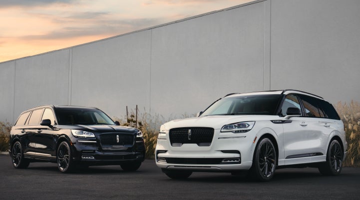 Two Lincoln Aviator® SUVs are shown with the available Jet Appearance Package | Thomasville Lincoln in Thomasville GA