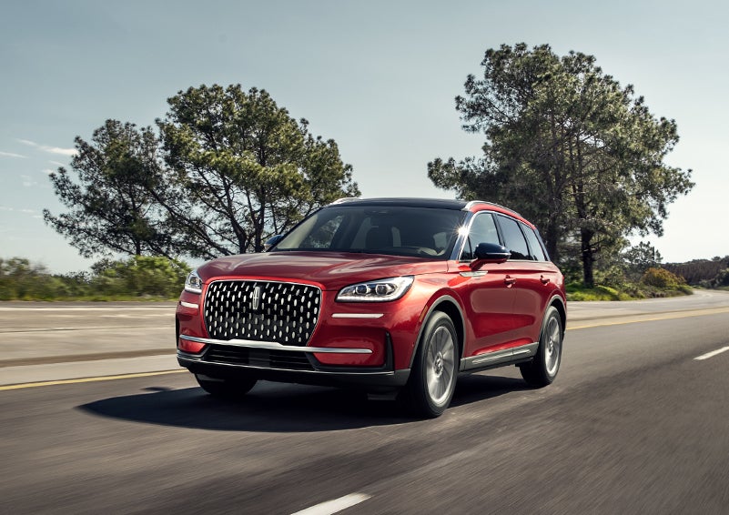 A 2024 Lincoln Corsair® SUV is shown being driven on a country road. | Thomasville Lincoln in Thomasville GA