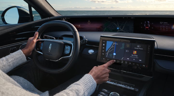 The driver of a 2024 Lincoln Nautilus® SUV interacts with the new Lincoln Digital Experience. | Thomasville Lincoln in Thomasville GA